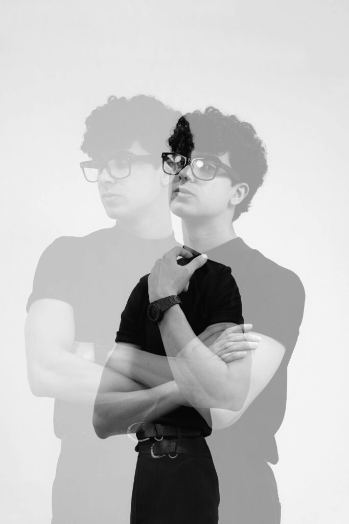 Creative double exposure of a man in black and white, offering a classic artistic vibe.
